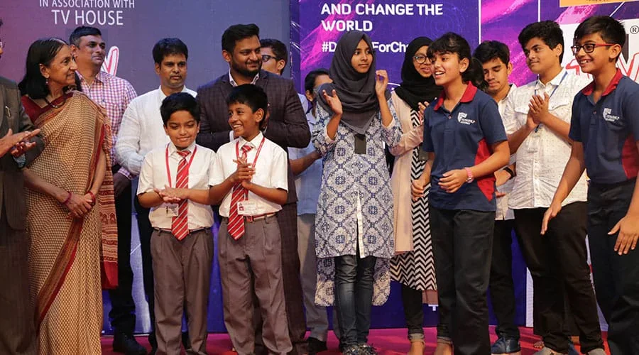 Students celebrating on stage